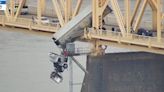 Driver crashes into side railing and flies off bridge with truck left dangling