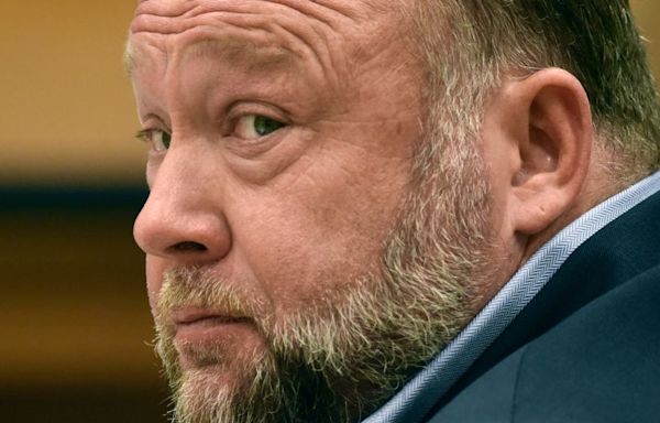 Alex Jones agrees to liquidate his assets to pay Sandy Hook families, in move that would end his ownership of Infowars