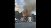 Crews battle blazing fire at historic building, across from where iconic Krispy Kreme burned down