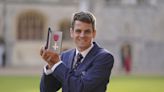 Triathlete Jonny Brownlee targets more Olympic glory as he collects MBE