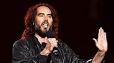 Russell Brand Laps Up Applause at Sold-Out Show Amid Harrowing Sex Assault Claims