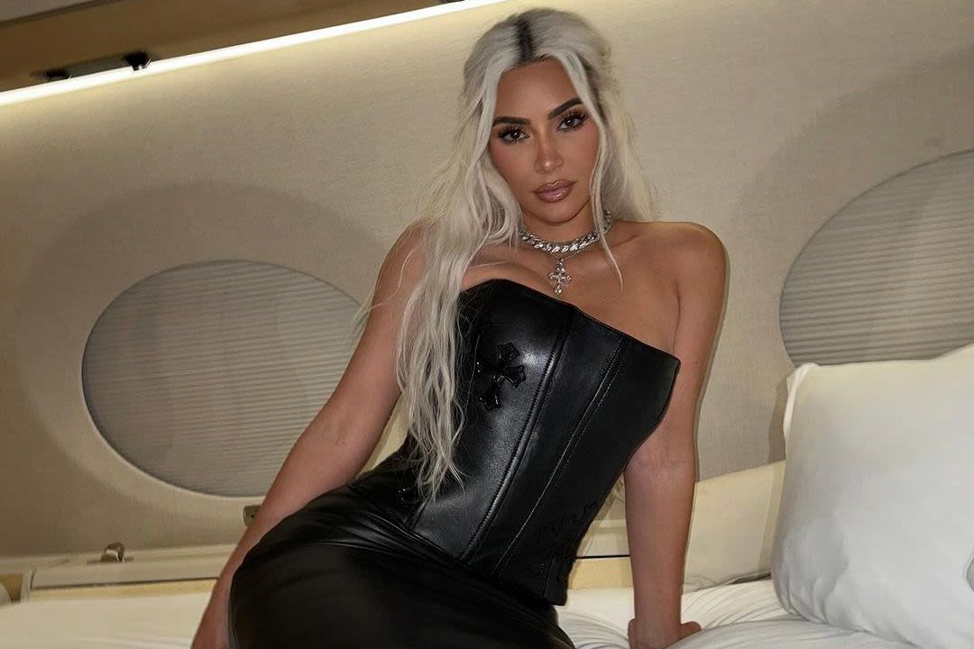 Kim Kardashian Strikes a Pose in Leather Set on Bed in Her Private Jet — Yes, There's a Corset