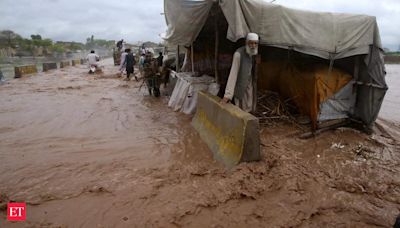 Flash flooding triggered by heavy monsoons in northwest Pakistan kills at least 14 people