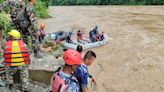 Nepal: 14 bodies found after buses swept into river by landslide, officals say