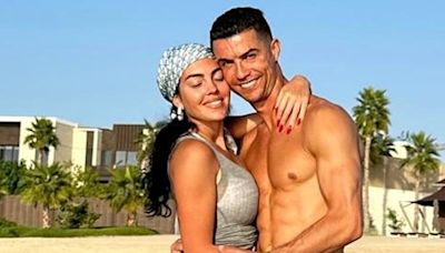 Cristiano Ronaldo poses in shirtless holiday snap alongside bikini-clad model girlfriend Georgina
