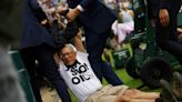 Wimbledon: Demonstrators dragged off after dumping confetti on grass courts to protest fossil fuels