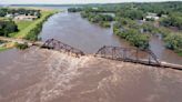 Midwestern flooding collapses a bridge, forces evacuations and kills at least 2