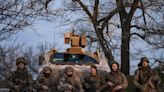 Ukrainian troops holding Bakhmut line demand weapons as world powers meet