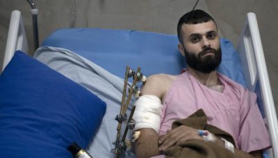A Palestinian was shot, beaten and tied to an Israeli army jeep. The army says he posed no threat