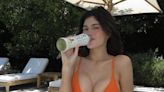 Kylie Jenner stuns in an orange bikini as she promotes her Glow drink