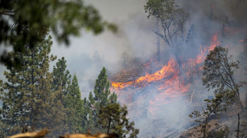 Firefighters cautiously watch the weather as Western wildfires spread