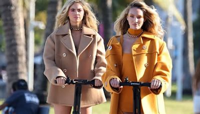 Candice Swanepoel and Kate Upton show off their long legs as they pose up a storm on Segways in high-fashion rompers
