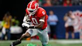 Georgia football's Darnell Washington falls to third round. Kelee Ringo goes in fourth.