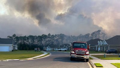 Two woods fire are burning in Jackson County, authorities say. 30 homes in danger