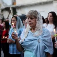 Palestinian Orthodox Christians attend Easter mass outside the church of Saint Porphyrius in Gaza City