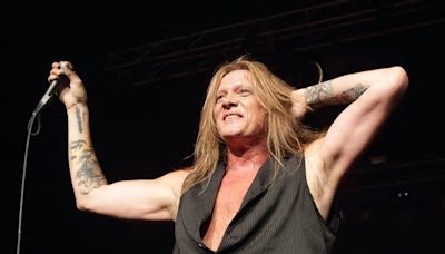 Ex-singer of popular hair metal band says ‘business’ is preventing a reunion