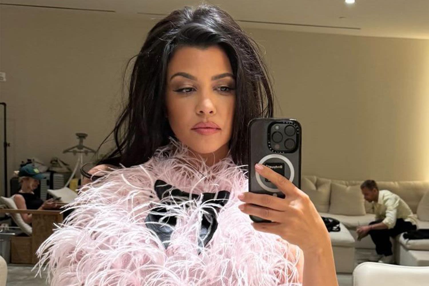 Kourtney Kardashian Poses in Pink Feathered Bodysuit in Behind the Scenes Look at Lemme Photo Shoot