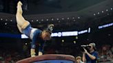 Watch Suni Lee of Auburn gymnastics tie her career high on vault with a 9.95