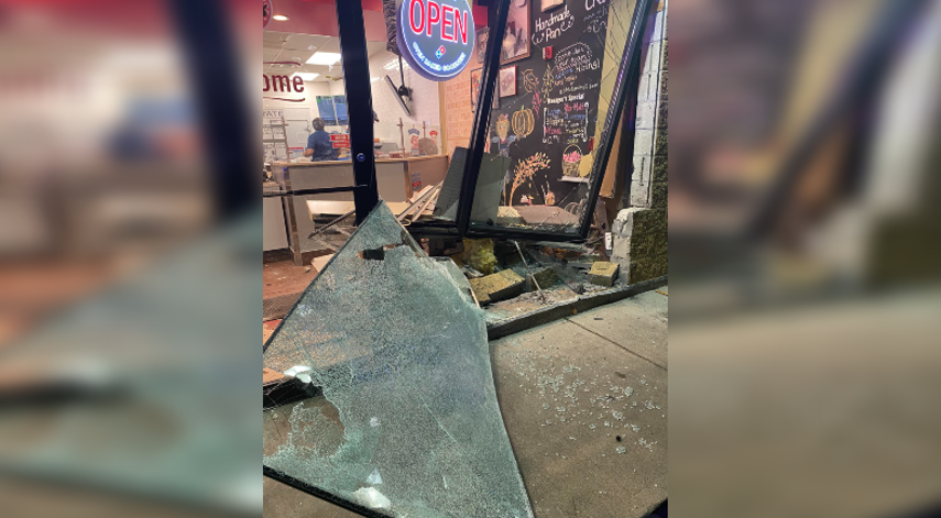 Car crashes into Domino’s in Warwick