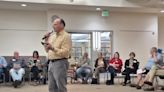 Community members discuss if government should provide free housing