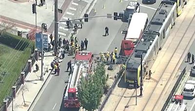 At least 55 people treated after Metro train crashes with USC bus in Southern California