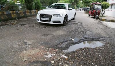 Potholed Cool Road gives commuters a bumpy ride