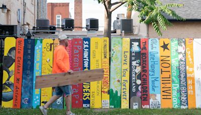 Book-themed fence mural honors late Topeka educator in NOTO Arts & Entertainment District