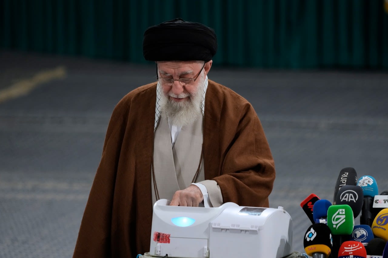 Iranians vote in parliamentary runoff election after hard-liners dominate initial balloting