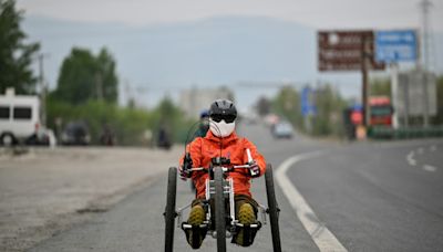 China wheelchair users claim outdoors with hand-cranked bikes