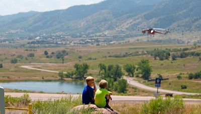 Wildfires in Colorado burn dozens of homes and structures, threaten hundreds more