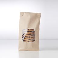 Sturdy paper bags suitable for holding a variety of treats, from candies to baked goods. Available in various colors and prints for different themes.