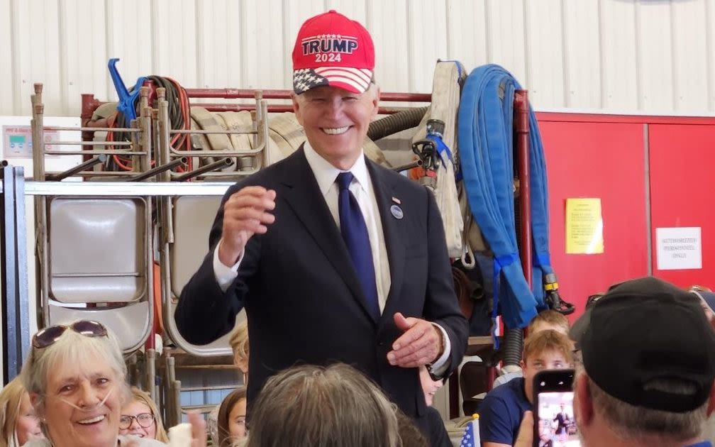 Joe Biden dons Trump cap ‘in spirit of unity’ at fire station