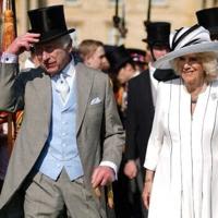 Britain's King Charles III and Queen Camilla attended a Royal Garden Party at Buckingham Palace while Prince Harry was in London
