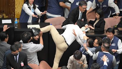 Taiwan’s parliament descends into chaos and punch-ups between MPs in ugly scenes during debate