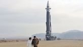 North Korean leader Kim Jong-un reveals daughter for first time at ICBM launch