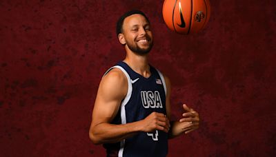 Steph happily exchanges pins with other Team USA athletes in Paris