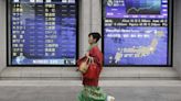 World shares hold firm, traders await inflation prints