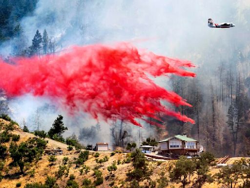 Wildfires rage across California while dangerous heat wave builds