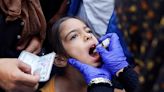 Palestinian children in south Gaza receive polio vaccinations amid continued war