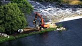 Faribault dam damaged by flooding, crews work to ease erosion