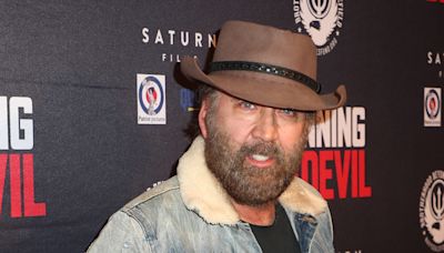 Nicolas Cage's bushy beard and cowboy hat are out in full force at movie premiere