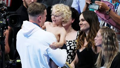 Adam Peaty hugs his son and girlfriend after incredible Olympic final