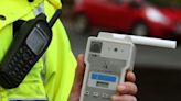 Drink driver caught after pulling up behind police car