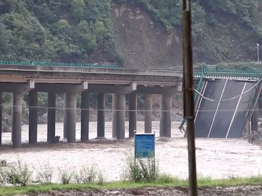 Bridge collapses in China killing 15 after flash floods