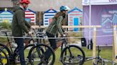 William and Kate cheered on as they show off bike skills