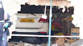Car crashes through wall of primary school