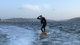 Wakeboarder Nearly Takes A Tumble When Surprised By An Unexpected Visitor