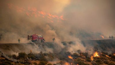 Firefighters battle 25 large wildfires in Oregon as record season blazes on