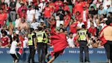 Olympic soccer gets off to violent and chaotic start as Morocco fans rush the field vs Argentina