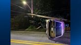 Vehicle rolls onto its side, shears pole during crash in Penn Hills